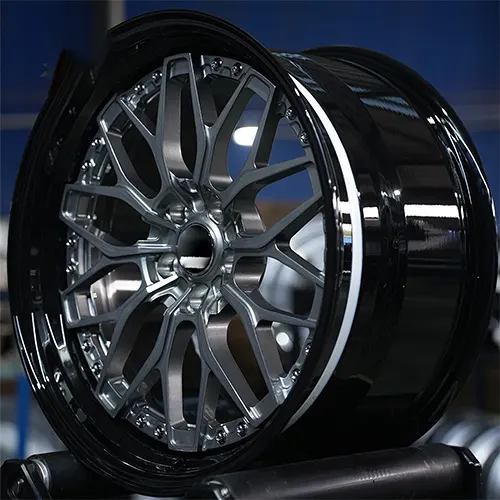 Angled Audi S5 two-piece forged wheel showing black rim and mesh depth