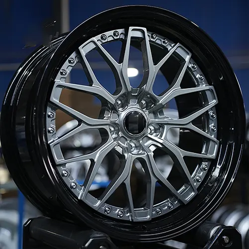 Front three-quarter Audi S5 mesh wheel with gunmetal face and exposed fasteners