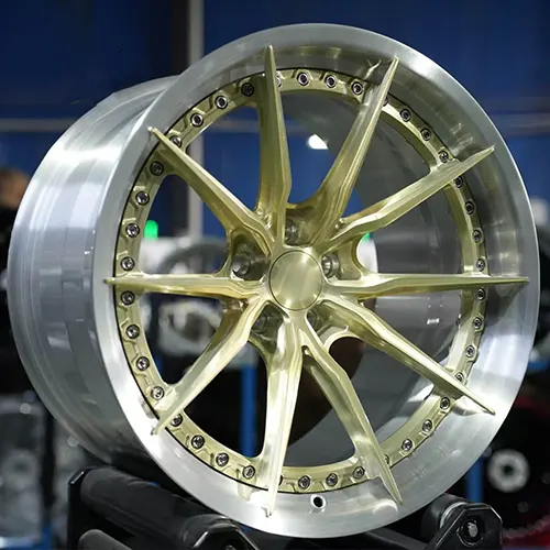 Three-quarter view of GT-R forged wheel showing champagne center and silver rim depth