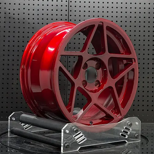 Angled Fiat 500 Turbo forged wheel showing Candy Red face and barrel depth