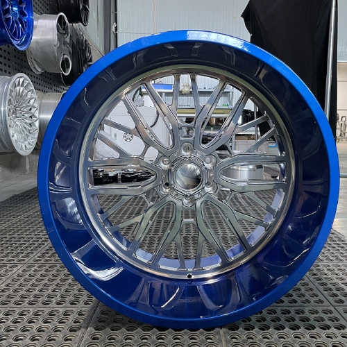 Cadillac Escalade monoblock wheel showing polished center and blue barrel