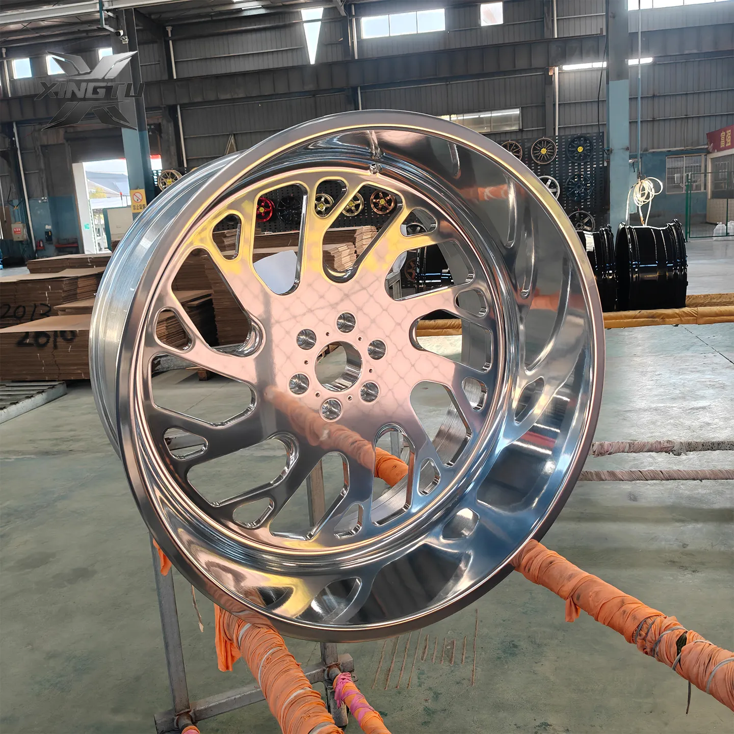 Real fully polished Silverado wheel with wide directional spokes and reflective aluminum surface