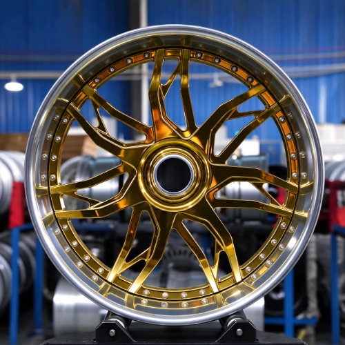 Finished Monte Carlo forged wheel with intricate gold spokes and exposed perimeter hardware