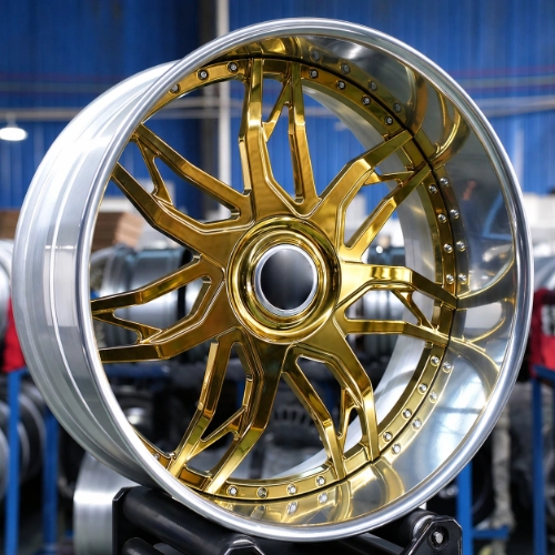 Close-up of gold electroplated two-piece wheel with polished deep lip and machined spokes