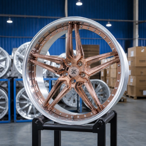 Angled view of rose gold forged two-piece wheel with brushed barrel and polished aluminum lip