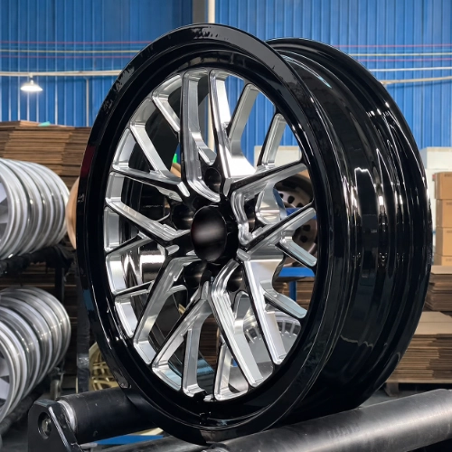 Three-quarter view of Camaro skinny front wheel showing black barrel and machined face