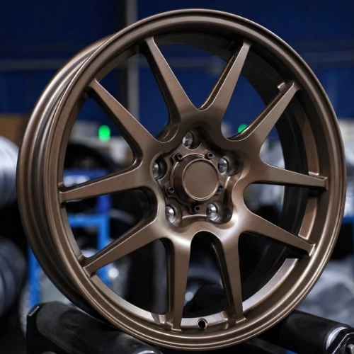 Close-up of matte bronze forged monoblock wheel with open ten-spoke geometry