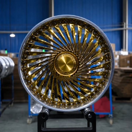 Close-up of gold turbine-style forged wheel with exposed assembly hardware and silver lip
