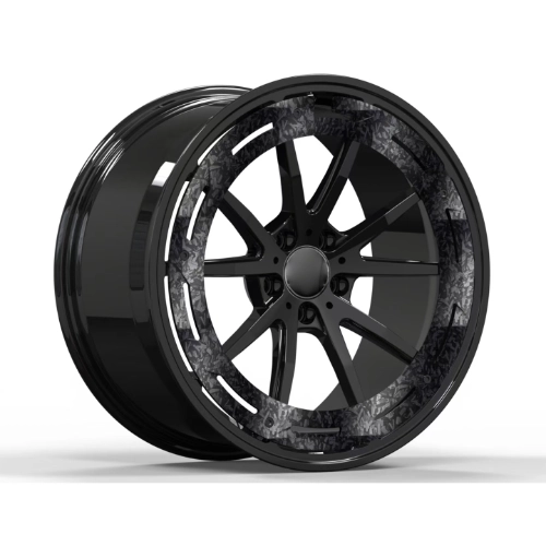Angled view of gloss black AMG forged monoblock wheel with carbon fiber face detailing