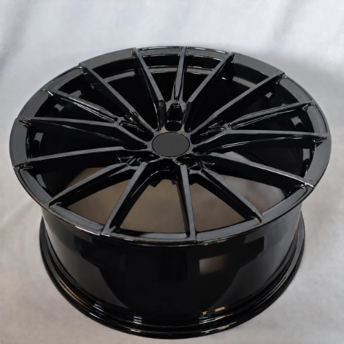 Gloss black forged monoblock wheel showing inner barrel and recessed spoke structure