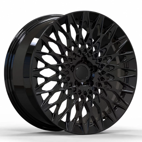 Three-quarter view of 20 inch gloss black forged wheel with intricate geometric spoke pattern