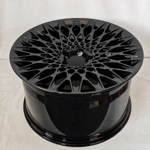 Elevated angle of Ferrari SF90 forged wheel with black mesh face and wide barrel