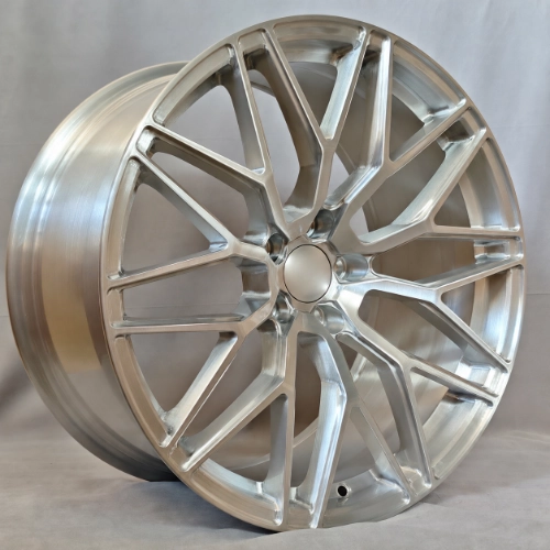 Three-quarter view of silver forged monoblock wheel showing machined spokes and deep barrel