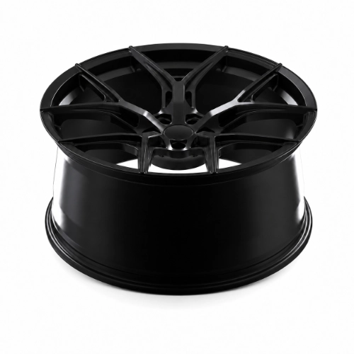 Three-quarter view of Audi forged wheel with angular split spokes and deep concave profile