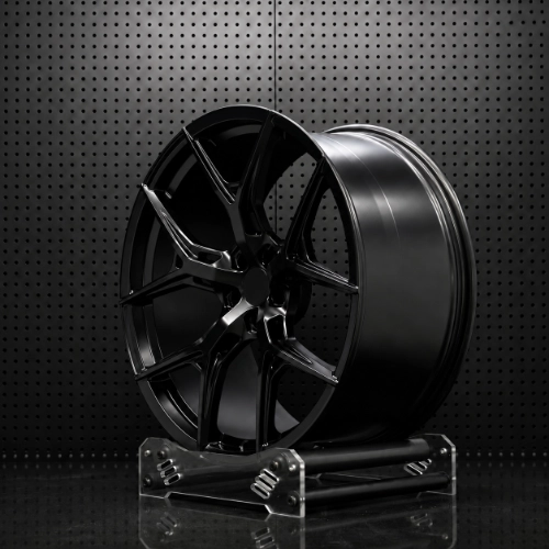 Front view of deep-concave forged wheel with five split spokes and machined openings